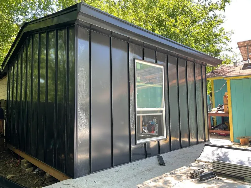 Black standing seam metal wall panels for Roof Inspection in Cicero